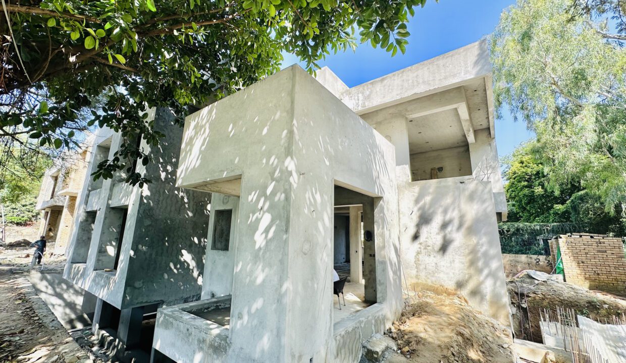 Grey structure stage of a luxury house under construction in F-6/4 Islamabad by HAY Builders